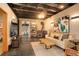 Cozy living room featuring modern furnishings, wood burning stove, and exposed ceiling at 116 Ramona Rd, Golden, CO 80403