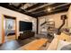 Inviting living room, adjacent bedroom, modern décor, and exposed ceiling beams at 116 Ramona Rd, Golden, CO 80403