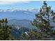 Incredible mountain view showcasing snow capped mountains and towering pines at 116 Ramona Rd, Golden, CO 80403
