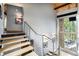 Staircase with steel railing, wood steps, and a large window offering views at 116 Ramona Rd, Golden, CO 80403