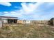 View of the home's backyard, patio, art, shed, and fencing at 34280 Columbine E Trl, Elizabeth, CO 80107
