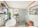 Bright bathroom with a soaking tub and glass-enclosed shower at 34280 Columbine E Trl, Elizabeth, CO 80107