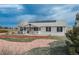 Charming home featuring a cozy front porch and updated exterior at 34280 Columbine E Trl, Elizabeth, CO 80107