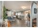 Spacious open kitchen features stainless appliances, stone countertops, and dining at kitchen island at 34280 Columbine E Trl, Elizabeth, CO 80107