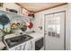 Laundry room with exterior access and plenty of storage for cleaning supplies at 34280 Columbine E Trl, Elizabeth, CO 80107