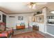 Comfortable living room featuring stylish decor, wood accents, and grey wood-look laminate flooring at 34280 Columbine E Trl, Elizabeth, CO 80107