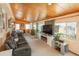 Comfortable bonus room offers plenty of natural light and access to backyard at 34280 Columbine E Trl, Elizabeth, CO 80107