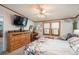 Comfortable main bedroom has ceiling fan and sitting area for relaxing at 34280 Columbine E Trl, Elizabeth, CO 80107