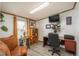 Cozy home office featuring a desk, sewing machine, and comfortable seating at 34280 Columbine E Trl, Elizabeth, CO 80107