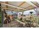 Covered patio with outdoor seating and decorative plants, perfect for relaxation at 34280 Columbine E Trl, Elizabeth, CO 80107