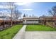 The backyard has lush grass, a detached garage, and a play area ideal for recreation at 2224 W 37Th Ave, Denver, CO 80211