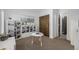 Bright bedroom featuring a large bookshelf, round table, and closet with sliding doors at 2224 W 37Th Ave, Denver, CO 80211