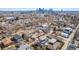 Aerial shot showcasing the house in its neighborhood with Denver skyline in the distance at 2224 W 37Th Ave, Denver, CO 80211