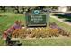 Well-maintained park sign with colorful flower beds adding charm and curb appeal at 1645 Tamarac St, Denver, CO 80220