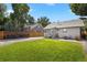 Expansive backyard offering ample space for outdoor entertaining, complete with a grill, seating, and a stylish wooden fence at 4312 Xavier St, Denver, CO 80212