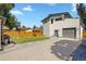 Large backyard featuring a well-maintained lawn, contemporary garage, and a wooden fence for added privacy at 4312 Xavier St, Denver, CO 80212