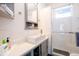 Updated bathroom with a glass shower door, tiled walls, and gray vanity at 4312 Xavier St, Denver, CO 80212