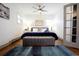 Bright bedroom featuring hardwood floors, neutral walls, and comfortable decor at 4312 Xavier St, Denver, CO 80212
