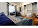 Bedroom featuring hardwood floors, a closet with built-ins, and comfortable decor at 4312 Xavier St, Denver, CO 80212