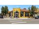 Eye-catching yellow building with large windows, outdoor seating, and a pedestrian crosswalk at 4312 Xavier St, Denver, CO 80212