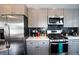 Modern kitchen featuring stainless steel appliances and light gray cabinetry at 4312 Xavier St, Denver, CO 80212