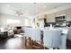 Open-concept kitchen and living area with a modern kitchen island at 4312 Xavier St, Denver, CO 80212