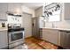 Charming kitchen featuring stainless steel appliances and light gray cabinetry at 4312 Xavier St, Denver, CO 80212