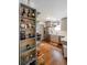 Stylish kitchen featuring stainless steel appliances, wood floors, and custom storage at 4312 Xavier St, Denver, CO 80212