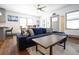 Cozy living room featuring a modern sectional, hardwood floors, and an open floor plan at 4312 Xavier St, Denver, CO 80212