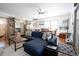Bright living room featuring hardwood floors, a ceiling fan and a comfortable navy sectional at 4312 Xavier St, Denver, CO 80212