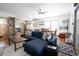 Bright living room featuring hardwood floors, a ceiling fan and a comfortable navy sectional at 4312 Xavier St, Denver, CO 80212