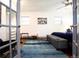 Bright main bedroom featuring hardwood floors, a ceiling fan, and plenty of natural light at 4312 Xavier St, Denver, CO 80212