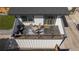 Outdoor deck features a table and chairs set on a decorative outdoor rug at 4312 Xavier St, Denver, CO 80212