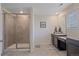 Light and airy bathroom with a glass-enclosed shower and vanity at 1202 Lance Leaf Ct, Elizabeth, CO 80107
