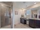 Bright bathroom with a glass-enclosed shower and granite countertop at 1202 Lance Leaf Ct, Elizabeth, CO 80107