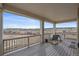 Comfortable covered deck area with beautiful views of the surrounding neighborhood and serene landscape at 1202 Lance Leaf Ct, Elizabeth, CO 80107