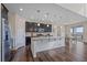 Modern kitchen featuring stainless steel appliances, a large island, and granite countertops at 1202 Lance Leaf Ct, Elizabeth, CO 80107