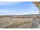 Expansive view from the property showcasing the natural landscape and neighboring homes in the distance at 1202 Lance Leaf Ct, Elizabeth, CO 80107