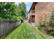 Well-maintained backyard lawn featuring beautiful landscaping and a multilevel deck at 11686 W 74Th Way, Arvada, CO 80005