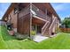 Backyard featuring a multilevel deck, brick exterior and a well-manicured lawn at 11686 W 74Th Way, Arvada, CO 80005