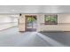 Basement with carpeting, sliding door access to the exterior and neutral wall color at 11686 W 74Th Way, Arvada, CO 80005