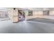 Spacious finished basement featuring carpet and a sliding door leading to the exterior stairs at 11686 W 74Th Way, Arvada, CO 80005