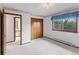 Light-filled bedroom with a closet and a window with valance at 11686 W 74Th Way, Arvada, CO 80005