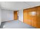 Comfortable bedroom with a view of a closet door and carpeted floors at 11686 W 74Th Way, Arvada, CO 80005