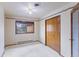 Neutral bedroom showcasing a closet, large window, and baseboard heating at 11686 W 74Th Way, Arvada, CO 80005