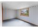 Bright bedroom featuring a large window offering a view of the lush outdoors at 11686 W 74Th Way, Arvada, CO 80005