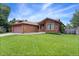 Well-maintained front yard showcasing the home's landscaping and brick exterior at 11686 W 74Th Way, Arvada, CO 80005