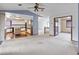 Large open floor plan provides great flow from kitchen to living room with a staircase nearby at 11686 W 74Th Way, Arvada, CO 80005