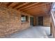 Spacious patio area with a brick exterior and seamless transition to the outdoors at 11686 W 74Th Way, Arvada, CO 80005