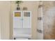 Bright bathroom featuring a modern white cabinet and a coordinated shower curtain at 6545 W 84Th Way # 132, Arvada, CO 80003